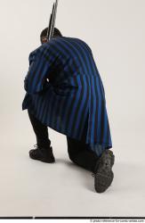 Garson KNEELING POSE WITH SHOTGUN